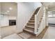 Unfinished basement with staircase, fireplace and ample space at 5022 E 17Th Ave, Denver, CO 80220