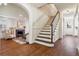 Elegant entryway with hardwood floors, staircase, and arched passage at 5022 E 17Th Ave, Denver, CO 80220