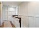 Upstairs hallway with wainscoting and hardwood floors at 5022 E 17Th Ave, Denver, CO 80220