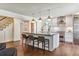 Modern kitchen with center island, stainless steel appliances, and hardwood floors at 5022 E 17Th Ave, Denver, CO 80220