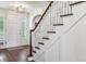 Classic staircase with white railings and dark wood steps at 5022 E 17Th Ave, Denver, CO 80220