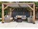 Inviting outdoor patio with comfortable seating and a fire table, complemented by a landscaped yard at 6088 S Lakeview St, Littleton, CO 80120