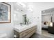 Bathroom features dual vanity and a framed mirror, and walk-in shower at 6088 S Lakeview St, Littleton, CO 80120