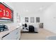 Bright bedroom featuring hockey-themed decor, a large jersey display, and sports memorabilia at 6088 S Lakeview St, Littleton, CO 80120