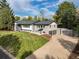 Stunning two-story home with a well-manicured lawn and an attached two-car garage at 6088 S Lakeview St, Littleton, CO 80120