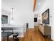 Bright foyer features hardwood floors, modern lighting and stairway at 6088 S Lakeview St, Littleton, CO 80120