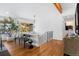 Bright living room features hardwood floors, bench seating, and a decorative tree at 6088 S Lakeview St, Littleton, CO 80120