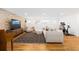 Spacious living room with brick accent wall, large windows, and open layout at 6088 S Lakeview St, Littleton, CO 80120