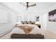 Comfortable bedroom with ceiling fan, neutral carpet, and light colored walls at 6088 S Lakeview St, Littleton, CO 80120