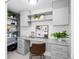 Charming office space with custom built-ins, neutral cabinets, and efficient storage solutions at 6088 S Lakeview St, Littleton, CO 80120