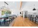 Inviting home with open-concept layout with sleek floors, dining table, and modern lighting at 6088 S Lakeview St, Littleton, CO 80120