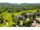 Gorgeous aerial view of neighborhood with mature trees and adjacent green space and walking path at 50 Deerwood Dr, Littleton, CO 80127