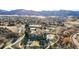 Aerial view of the community amenities including tennis courts, playground, and a swimming pool at 50 Deerwood Dr, Littleton, CO 80127