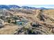 Aerial view showcasing community amenities including tennis courts, playground, and pool at 50 Deerwood Dr, Littleton, CO 80127