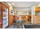Open basement featuring bar-style seating and wood cabinetry, perfect for entertaining guests at 50 Deerwood Dr, Littleton, CO 80127