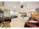 Basement featuring a projector, fireplace, and leather couches, perfect for a home theater at 50 Deerwood Dr, Littleton, CO 80127
