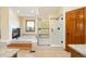 Bathroom featuring a soaking tub, a separate glass enclosed shower, and granite countertops at 50 Deerwood Dr, Littleton, CO 80127