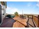 Expansive wooden deck with outdoor furniture and scenic views, ideal for relaxation and entertainment at 50 Deerwood Dr, Littleton, CO 80127