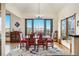 Bright dining room offering an elegant setting with large windows, hardwood floors, and mountain views at 50 Deerwood Dr, Littleton, CO 80127