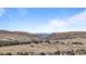 Distant cityscape view, nestled between gorgeous rock formations at 50 Deerwood Dr, Littleton, CO 80127