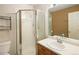 Tidy bathroom showcasing a glass-enclosed shower and a single sink vanity with modern fixtures, ideal for a refreshing experience at 1885 S Quebec Way # M101, Denver, CO 80231