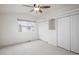 Cozy bedroom with soft carpet, large windows, and closet doors, offering ample storage and a bright, airy feel at 1885 S Quebec Way # M101, Denver, CO 80231