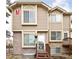 Charming townhome featuring a combination of brick and siding with a welcoming front entry staircase at 1885 S Quebec Way # M101, Denver, CO 80231