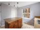 Kitchen island provides counter space and storage at 1885 S Quebec Way # M101, Denver, CO 80231