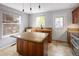 Kitchen with modern amenities and natural light at 1885 S Quebec Way # M101, Denver, CO 80231