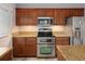 Well-equipped kitchen with stainless steel appliances and ample storage at 1885 S Quebec Way # M101, Denver, CO 80231