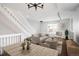 Open-concept living area with staircase, hardwood floors, and stylish decor for a modern feel at 1885 S Quebec Way # M101, Denver, CO 80231