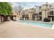 Community pool with lounge area, picnic tables, and well-maintained surroundings for residents' enjoyment at 1885 S Quebec Way # M101, Denver, CO 80231