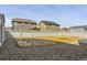 Large, gravel backyard with a white fence, providing a secure and low-maintenance outdoor space at 6491 N Danube St, Denver, CO 80249
