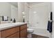 Well-maintained bathroom with a single sink vanity, and shower-tub combination at 6491 N Danube St, Denver, CO 80249