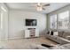 Cozy living room with neutral carpet, TV on wall, and modern decor at 6491 N Danube St, Denver, CO 80249