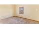 Bedroom featuring carpet, neutral paint and small window at 540 Hickory St, Hudson, CO 80642