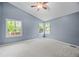 Spacious bedroom with a vaulted ceiling, ceiling fan and ample natural light from multiple windows at 18121 E Adriatic, Aurora, CO 80013