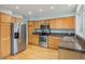 Modern kitchen with hardwood floors, stainless steel appliances, and granite countertops at 18121 E Adriatic, Aurora, CO 80013