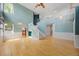 Spacious living room with hardwood floors, large windows, and a staircase leading to the second floor at 18121 E Adriatic, Aurora, CO 80013