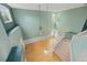 Lofted view of a two-story living room with hardwood floors and a modern lighting fixture at 18121 E Adriatic, Aurora, CO 80013