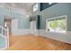 Bright living room boasting hardwood floors, large windows, and an open floor plan at 18121 E Adriatic, Aurora, CO 80013