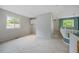 Bright loft area with neutral carpet, white trim, and a window with a view of the outdoors at 18121 E Adriatic, Aurora, CO 80013
