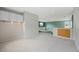 Open loft area with neutral carpet, built-in cabinets and a view of the lower level at 18121 E Adriatic, Aurora, CO 80013