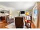 Bright living room featuring wood floors, a large window with natural light, and comfortable seating at 335 N 16Th Ave, Brighton, CO 80601