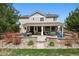 Beautiful backyard with spacious patio and stone retaining wall at 5207 Denim Ct, Parker, CO 80134