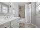 Bathroom featuring shower with white curtain, updated vanity and a large mirror at 5207 Denim Ct, Parker, CO 80134