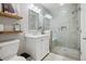 Modern bathroom featuring a glass-enclosed shower and stylish vanity at 5207 Denim Ct, Parker, CO 80134
