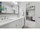 Well-lit bathroom featuring double sinks with a view into the bedroom at 5207 Denim Ct, Parker, CO 80134