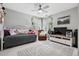 Comfortable bedroom featuring natural light from the window and a ceiling fan at 5207 Denim Ct, Parker, CO 80134