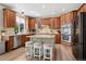 Modern kitchen with stainless steel appliances, granite countertops, and a center island at 5207 Denim Ct, Parker, CO 80134